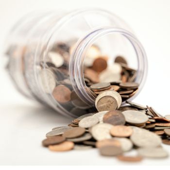 Jar full of coins representing personal finances linking to credit options