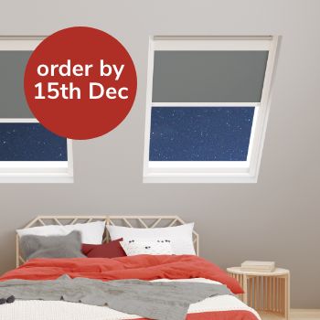 Two skylights fitted in a bedroom with grey fabric